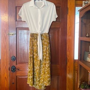 BEAUTIFUL Dress with white front tie top and flowered bottom.